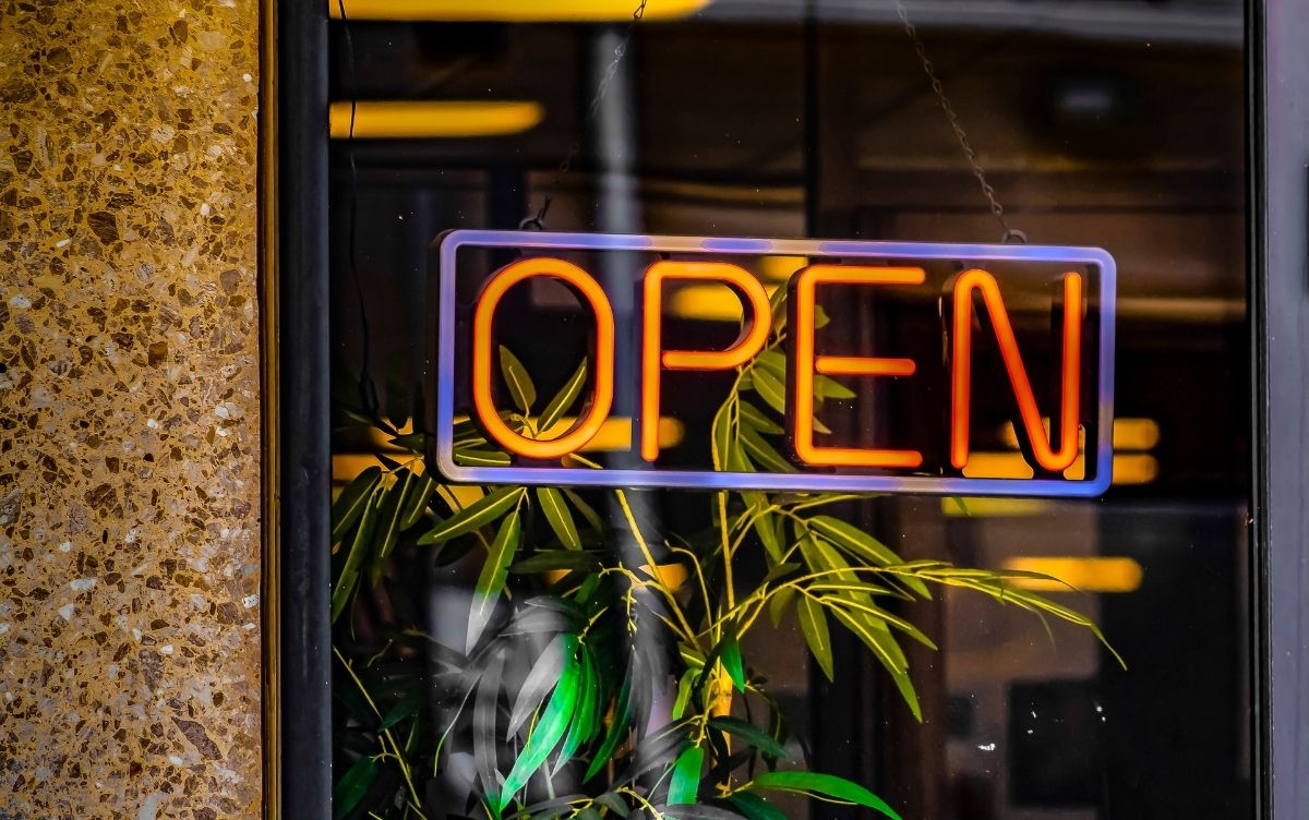 Red LED open sign in the window of a restaurant
