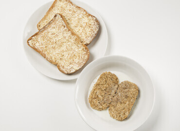 Picture showing two wheat bisks and toast with lower fat spread