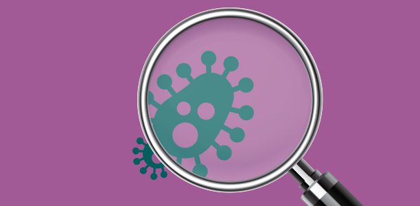 Magnifying glass examining bacteria