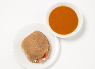 image showinga homemade tomato soup and a cheese and tomato wholemeal roll
