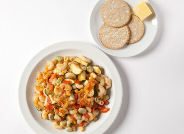 Photo of a pasta ratatouille bake with oatcakes and cheese