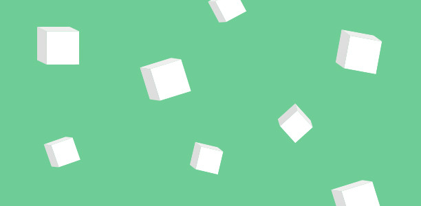Sugar cubes on a green background