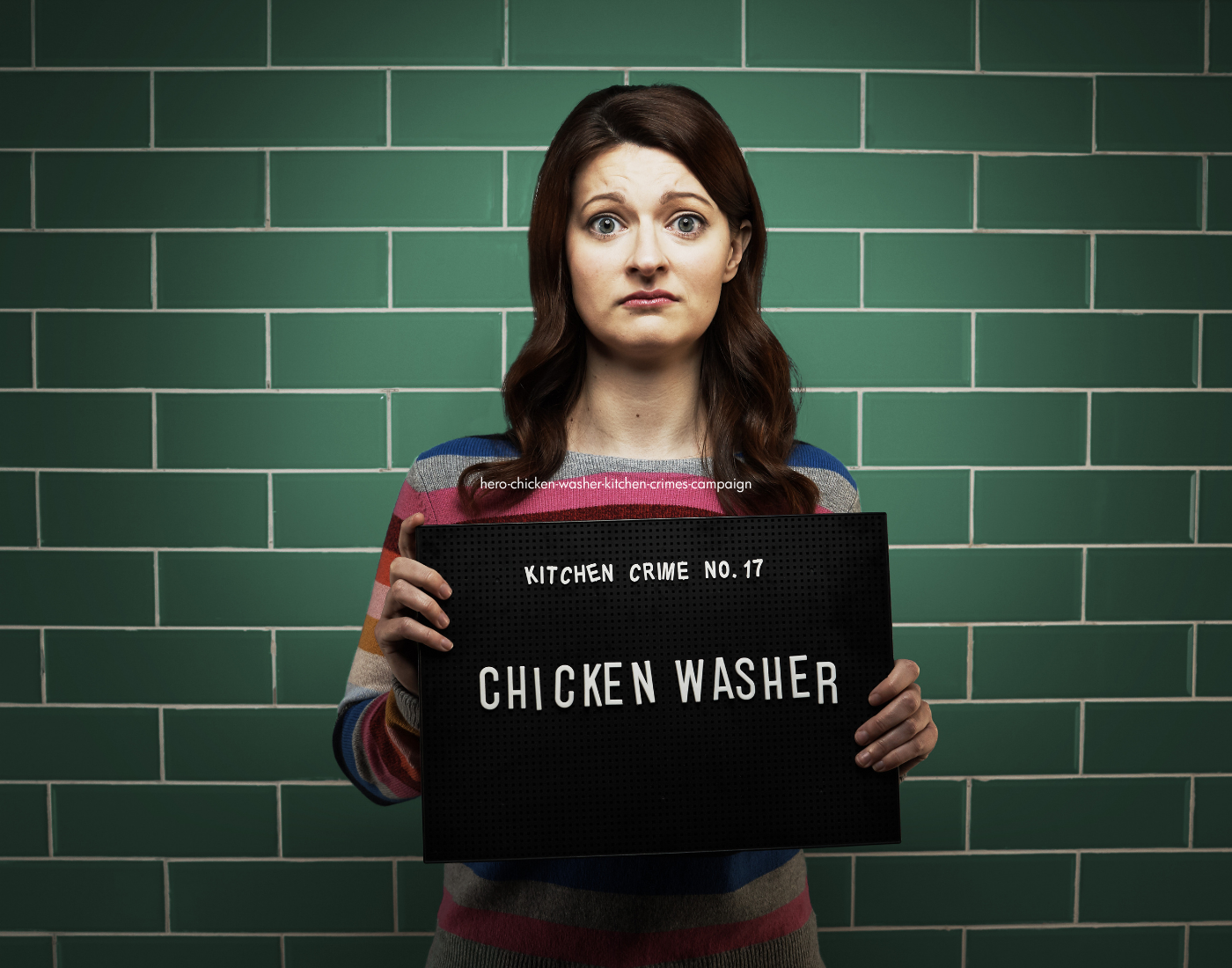 Woman holding mug shot board with wording Chicken Washer