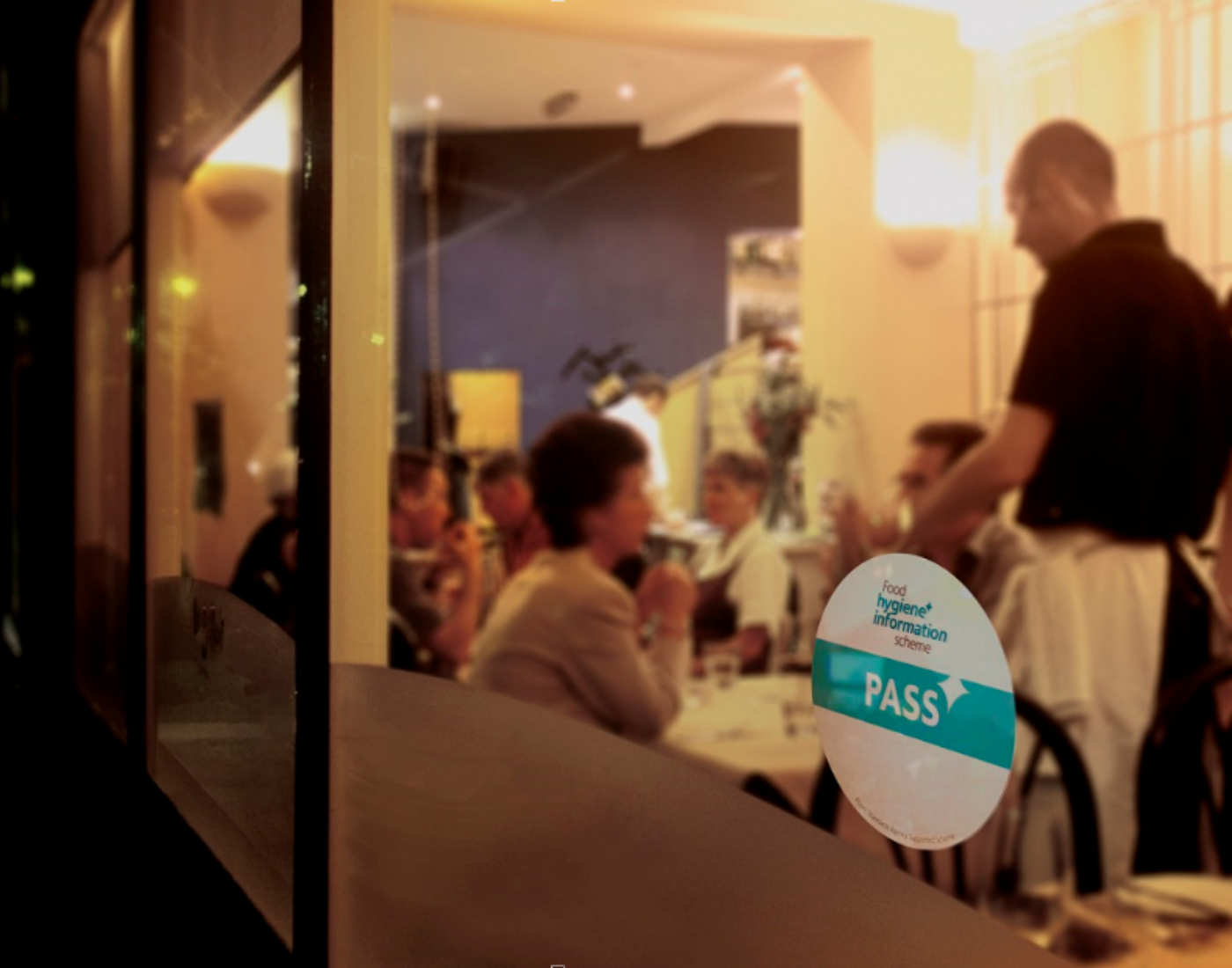 Restaurant widow showing Food Hygiene Information scheme sticker