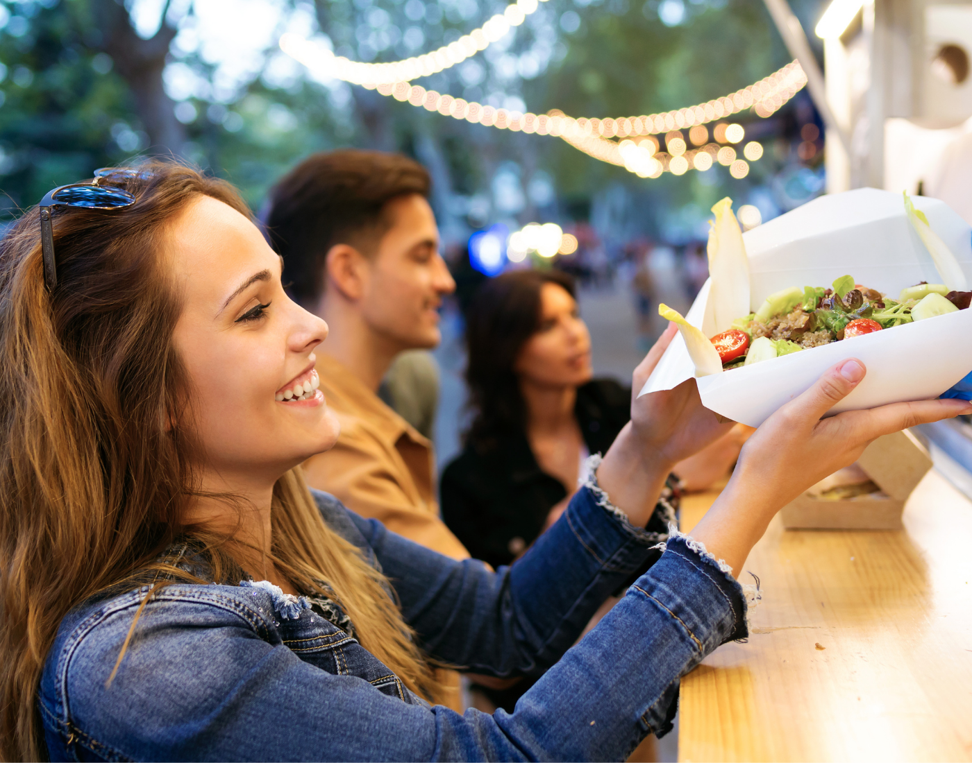 Woman receiving food from a food business