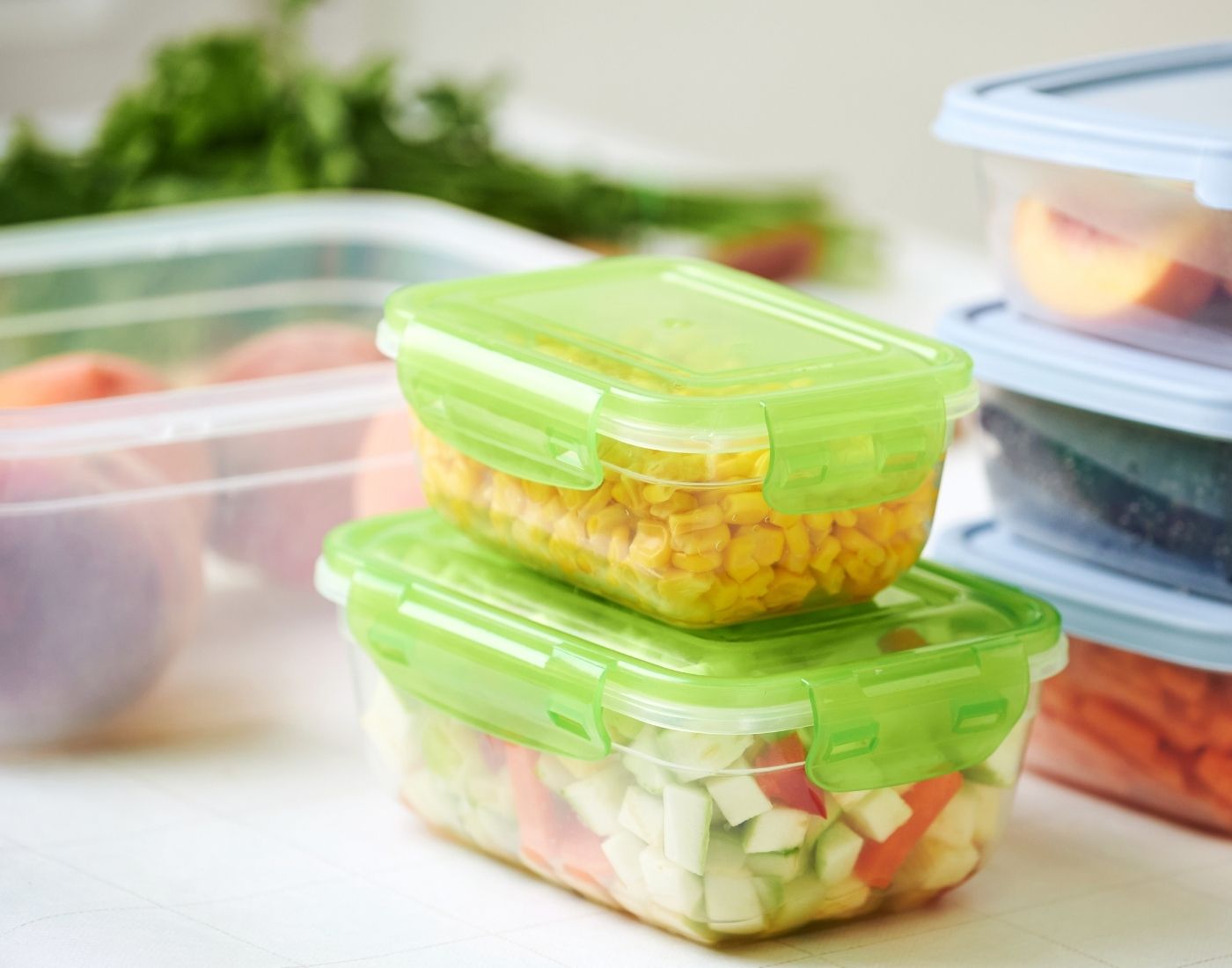 Fruit and vegetables stored in five different sealed containers