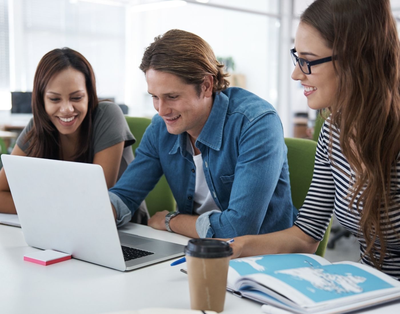 Group of people doing research on a laptop