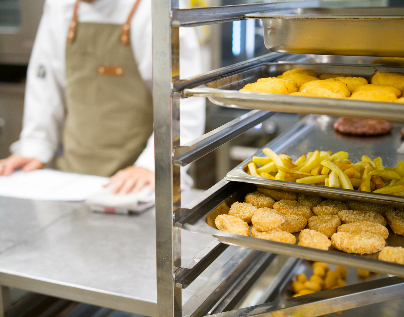 Burgers, chicken nuggets, chips waiting to be served to customers