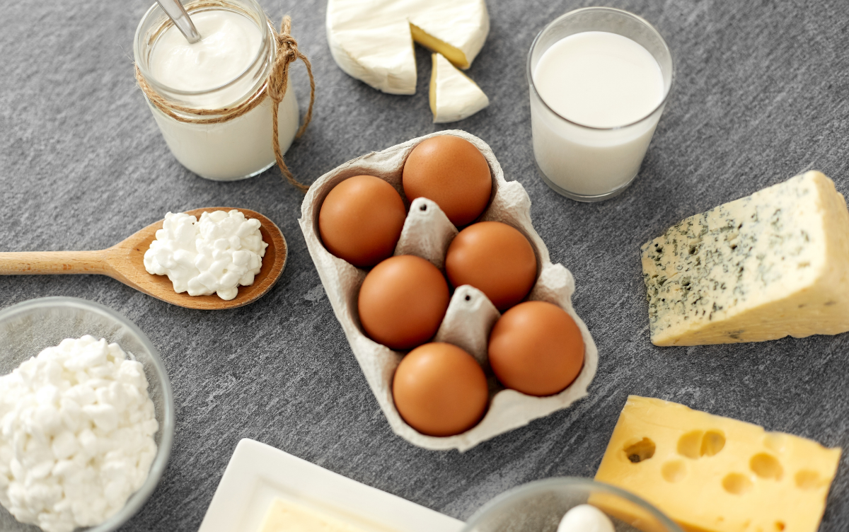 A table with milk, dairy and eggs on it