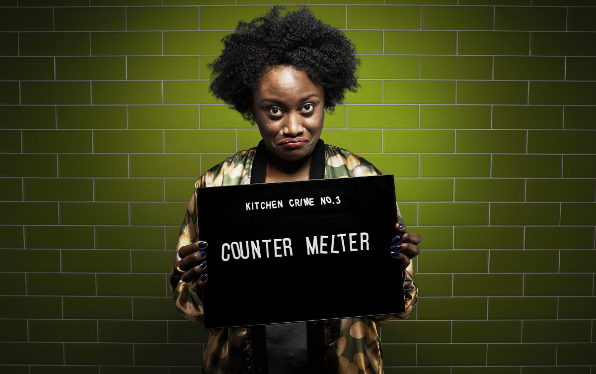 Woman holding mug shot board with words Counter Melter