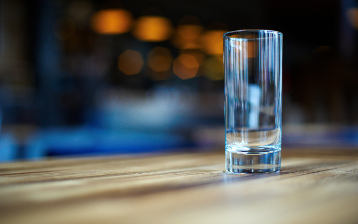 an empty drinks glass sitting on a table