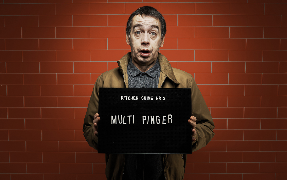 Woman holding mug shot board with words Multi Pinger