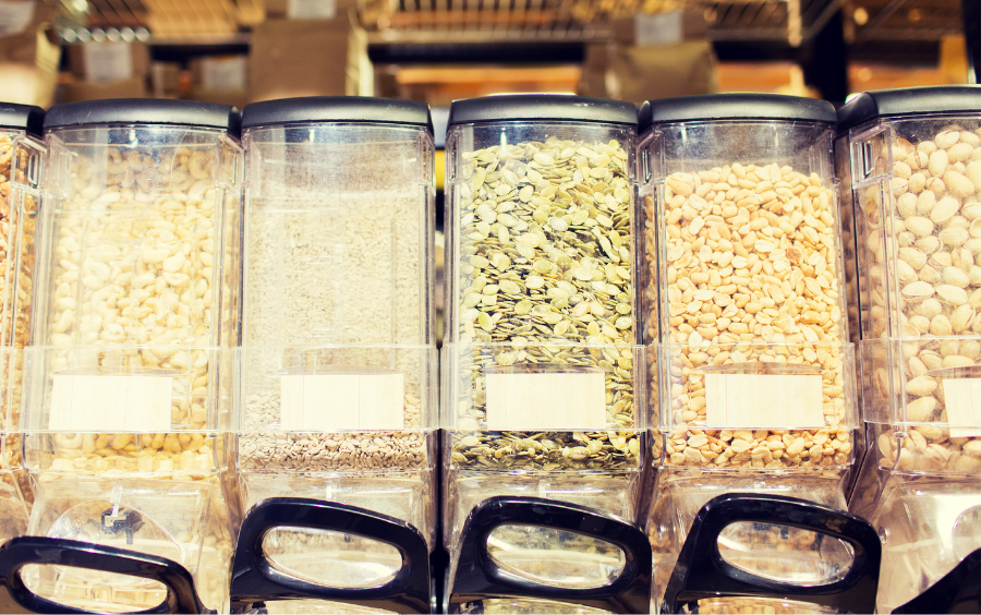 Tub dispensers of loose seeds in a shop 